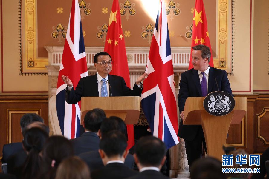 6月17日，國務(wù)院總理李克強(qiáng)同英國首相卡梅倫在倫敦舉行中英總理年度會晤后共同會見記者。新華社記者 龐興雷 攝