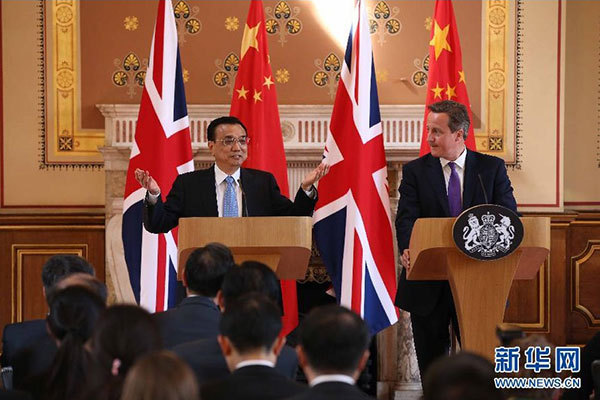     6月17日，國務院總理李克強同英國首相卡梅倫在倫敦舉行中英總理年度會晤后共同會見記者。 新華社記者 龐興雷 攝 